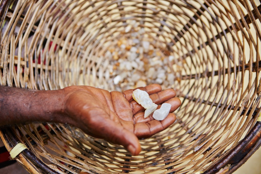 3 moon stones in a hand after being harvested, perfect crystals for motherhood 