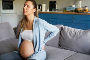 Pregnant woman full of pain, kidney stone in pregnancy, pregnant woman with kidney stone