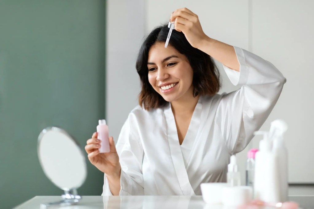 Pretty middle eastern brunette woman having face care routine, evening routine for busy moms